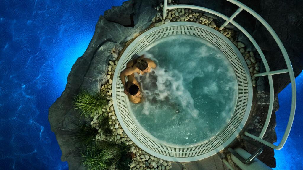 A couple enjoying time in a spa pool