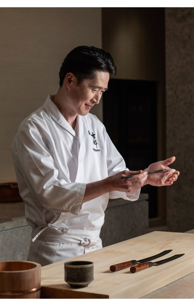 The chef examining the tools needed to prepare the food dishes