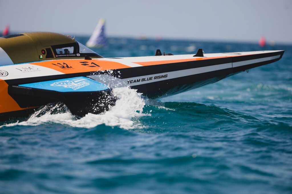 A close up view of the side of the Team Blue Racing boat