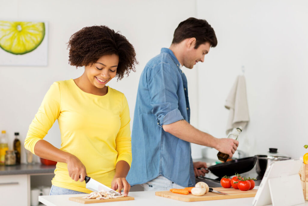 A couple preparing food in their kitchen