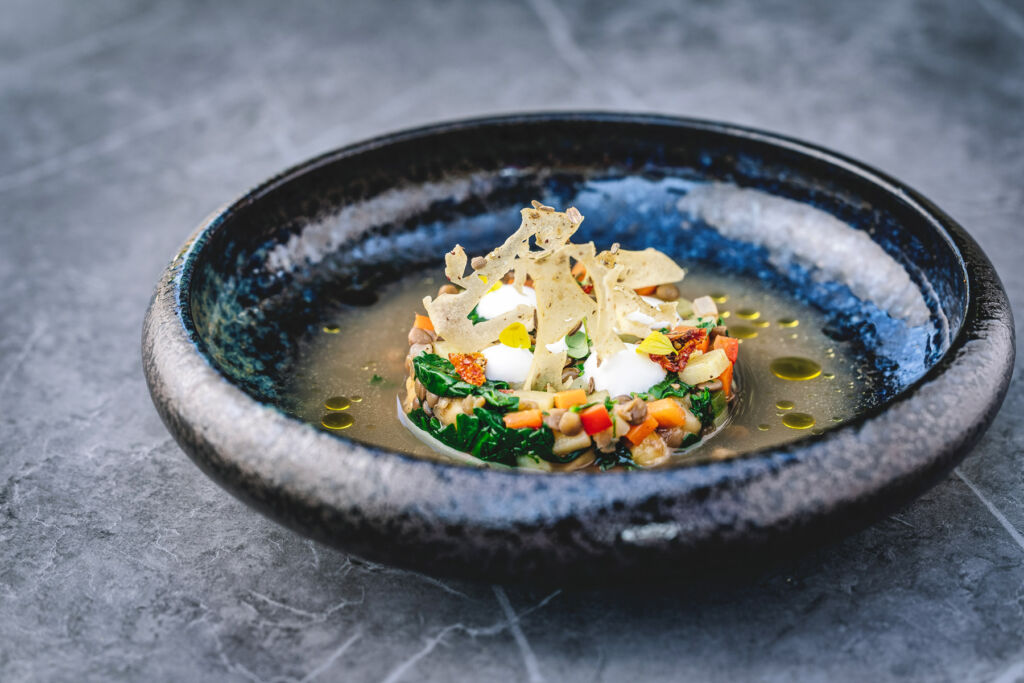 A dish of spinach, chickpea stew with wild rice