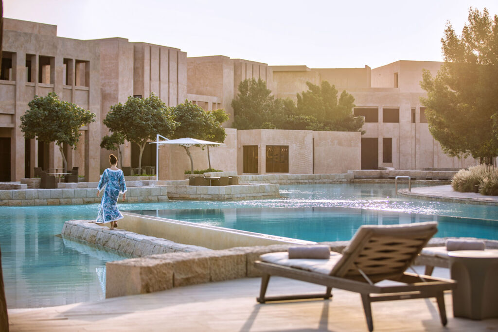 A woman walking through the resort grounds