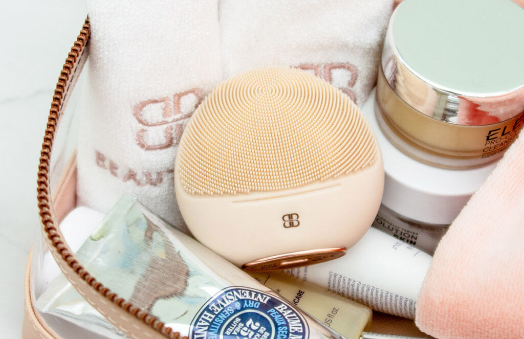 The device placed in a basket of beauty products