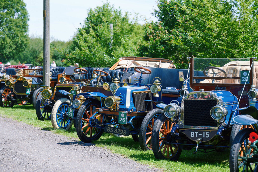 The historical cars lined up on the lawn