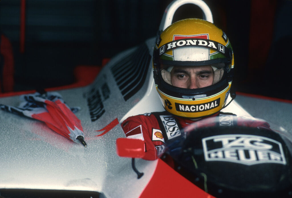 Senna waiting in his car out of the rain in 1988