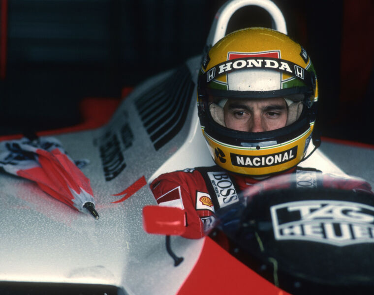 Senna waiting in his car out of the rain in 1988