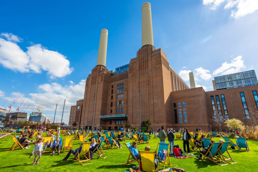 People enjoying the sunshine in the grounds of the iconic power station