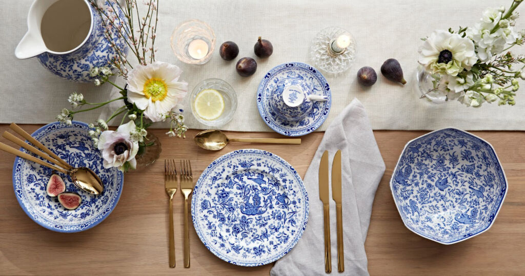 A top down view of a table setting with blue and white pottery