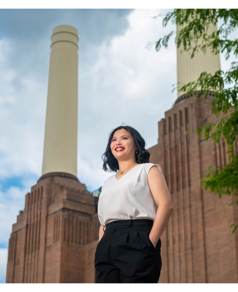 Mandy standing in front of the power station chimneys