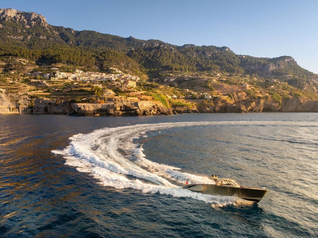 The boat running along the coast