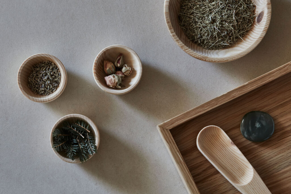 Various herbs in stone bowls