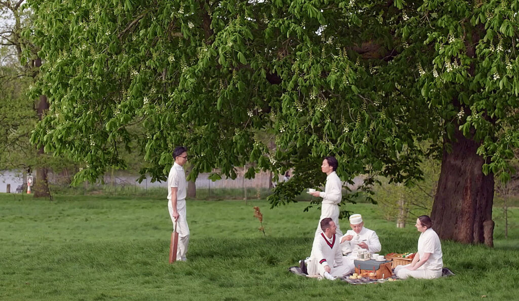 Kam enjoys British afternoon tea after a game of cricket in Hyde Park