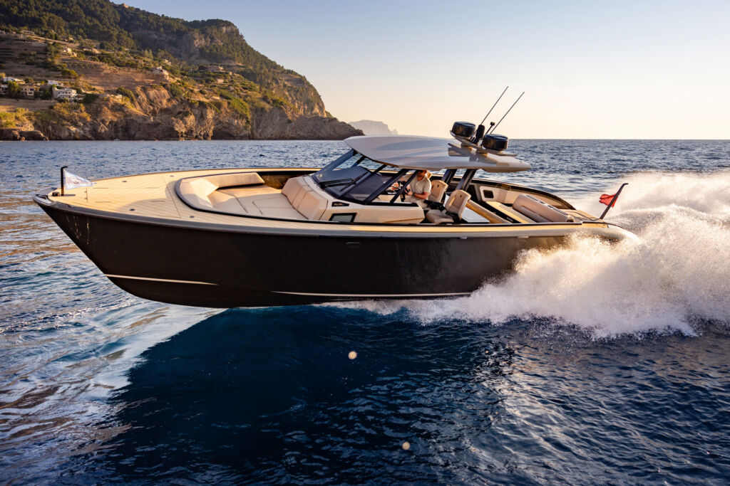 The boat travelling at speed on the water