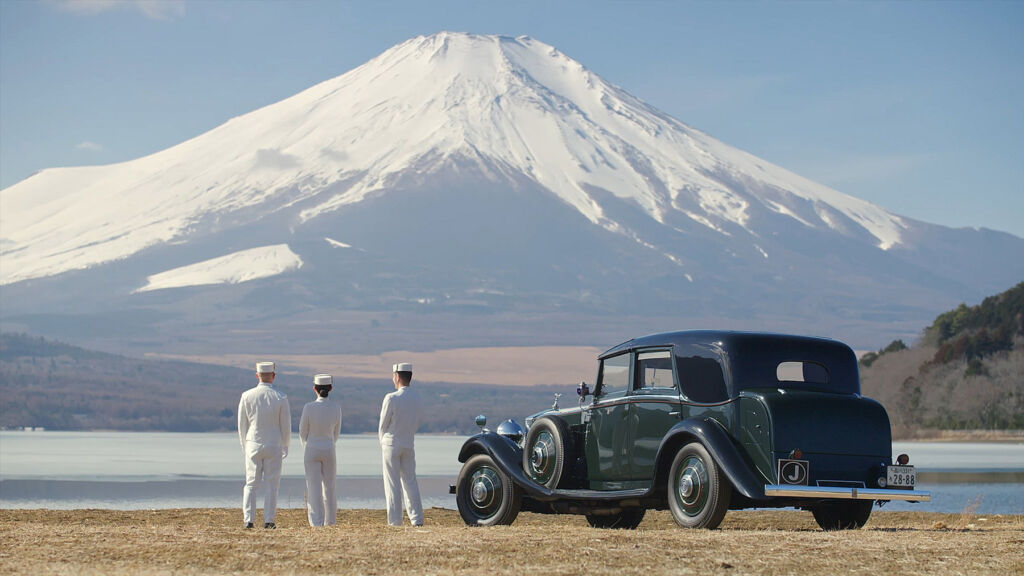 Kam admiring the majestic snow capped Mount Fuji