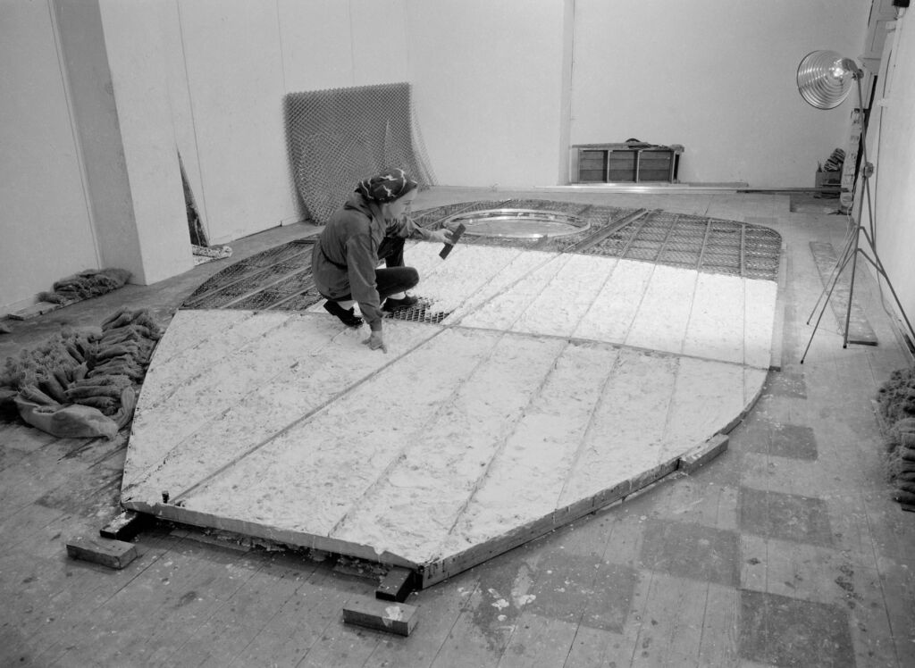 Barbara Hepworth working on the building's floor