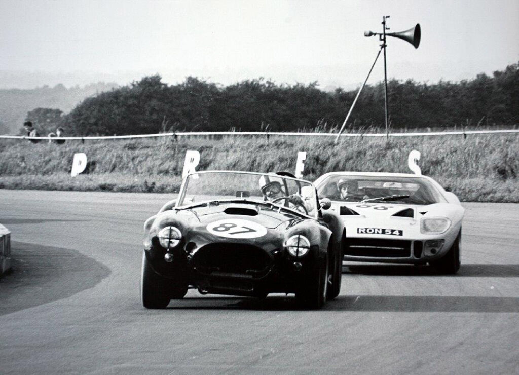 A black and white photograph of the car on a race track