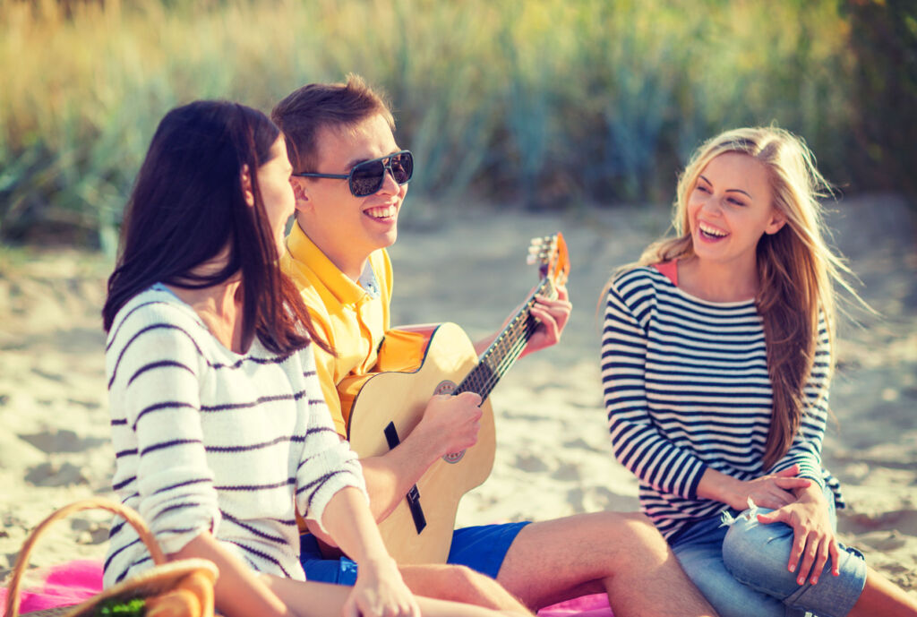 Young people enjoying themselves on a beach