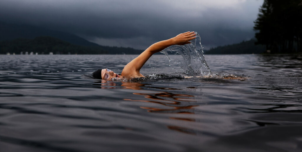 Wild swimming on a cloudy and misty day