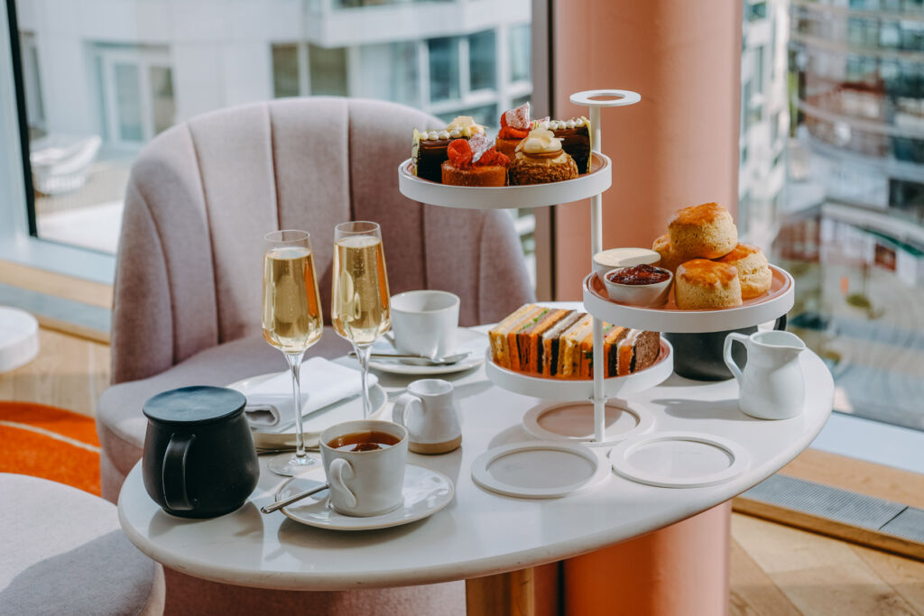 The afternoon tea on a white table ready to be enjoyed