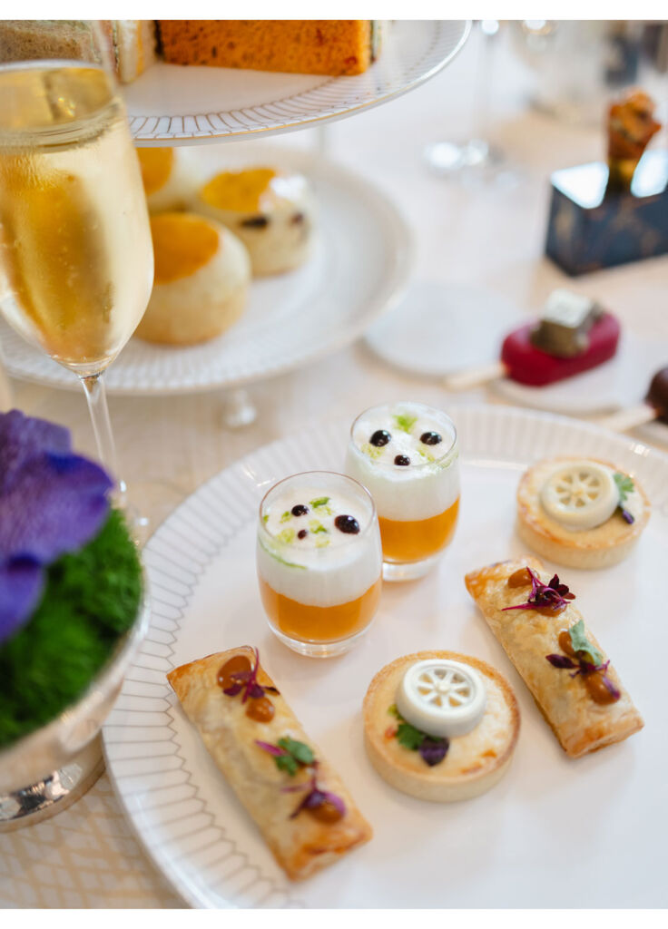 A top down view of the sweets and savouries that comes with the tea