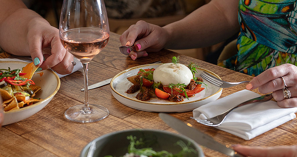 Diners enjoying the Burrata