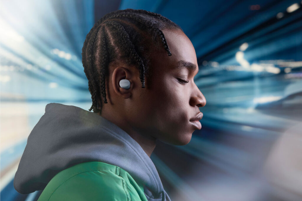 A man enjoying the audio from the earbuds