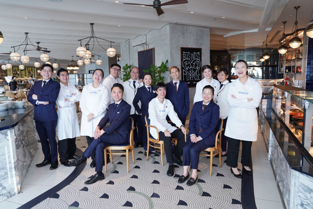 Some of the graduates with members of the hotel team