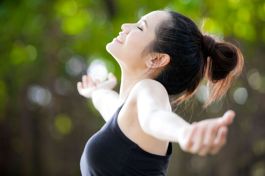 A young woman enjoying being outdoors in nature