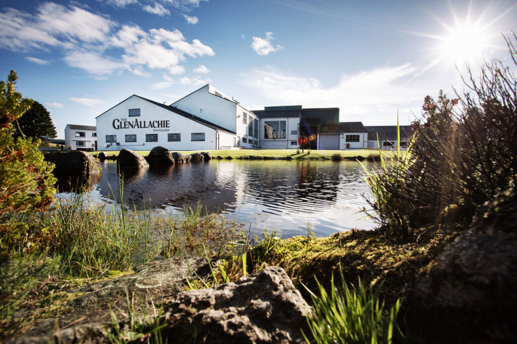 A photograph showing the exterior of the distillery with its waterfront location