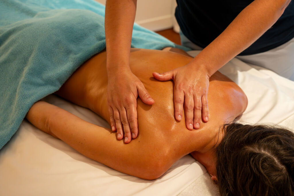 A female guest getting a massage treatment