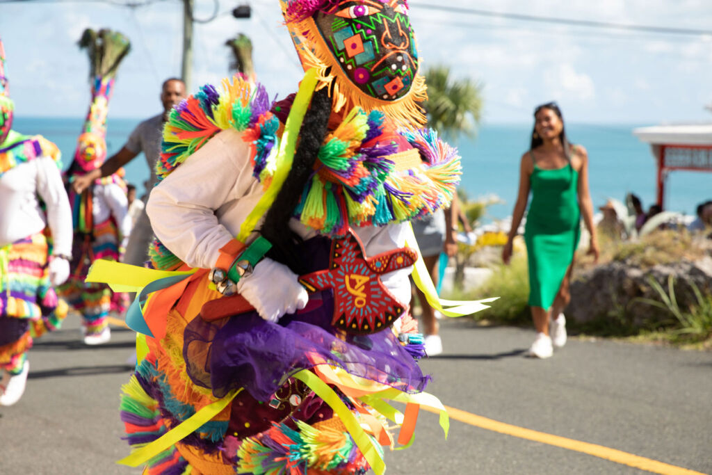 A traditional dancer dressed in a colourful outfit