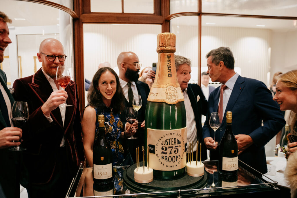 A cake in the shape of a champagne bottle