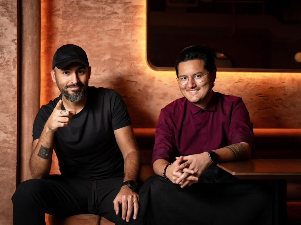 Jay Khan and Ajit Gurung sitting on a coach in the Savory Project