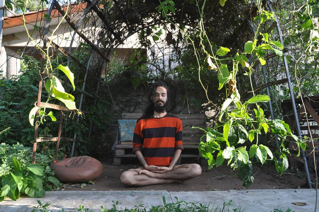 Kaio meditating outdoors