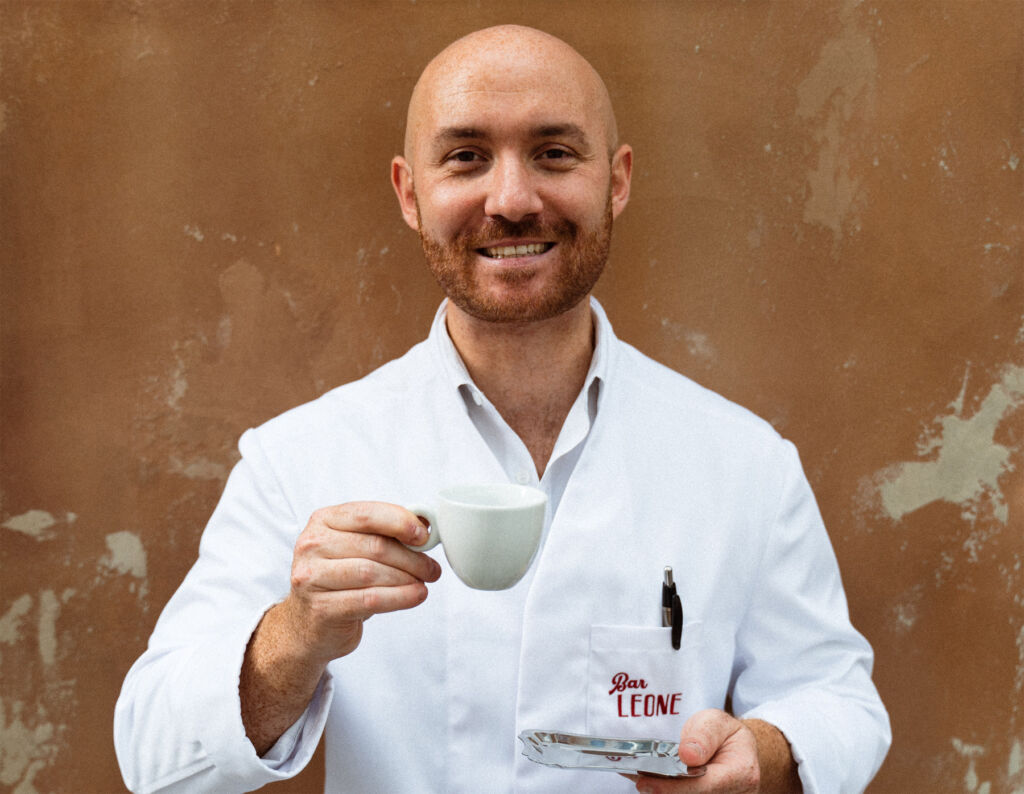 Lorenzo celebrating with a cup of coffee