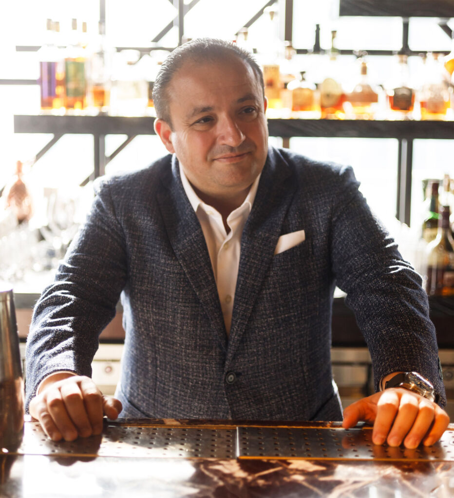 Serhan Kusaksizoglu behind one of the bars