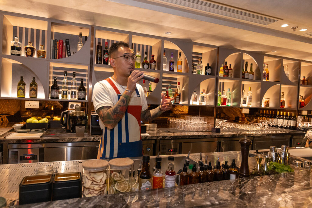 Samuel Kwok working behind his bar