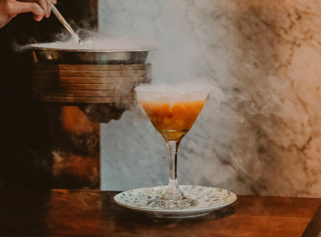 A smoking cocktail being served