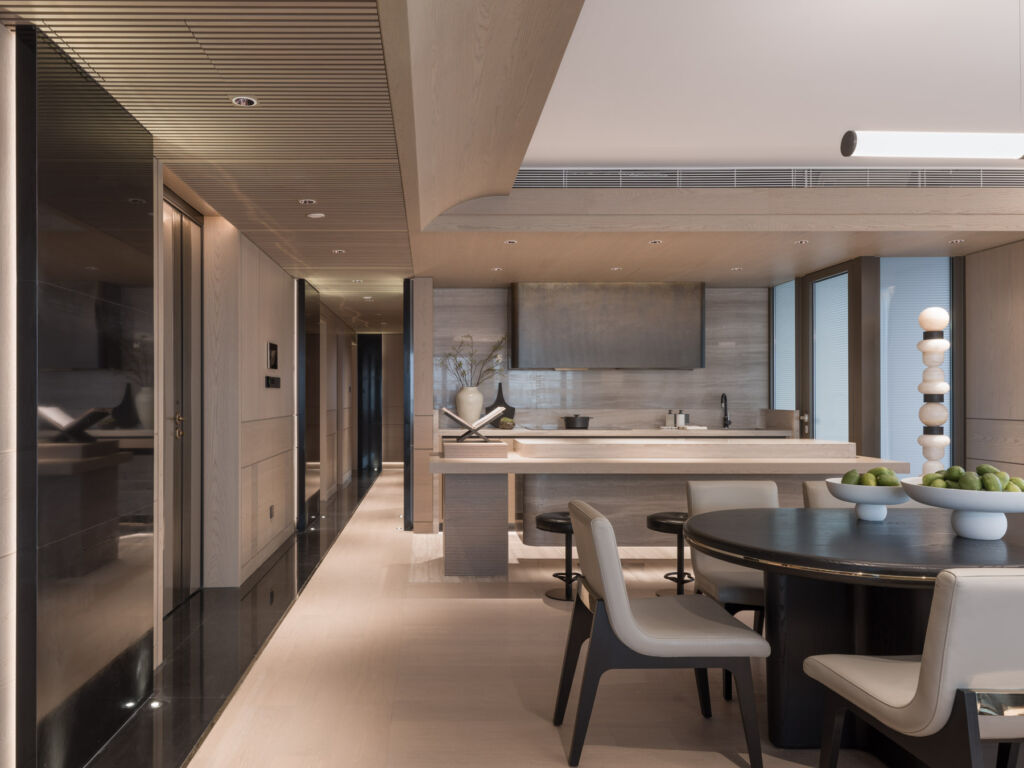 The dining and kitchen areas in a luxury residential apartment