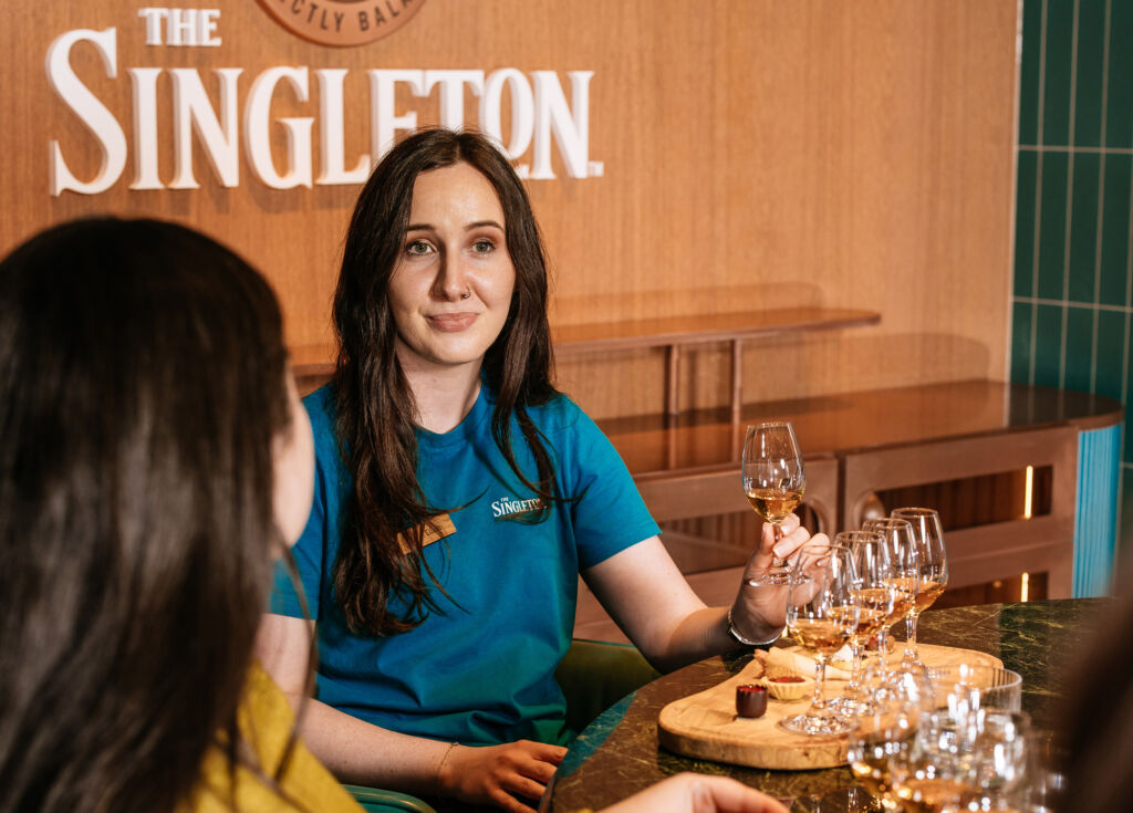 A member of the team organising drinks for guests