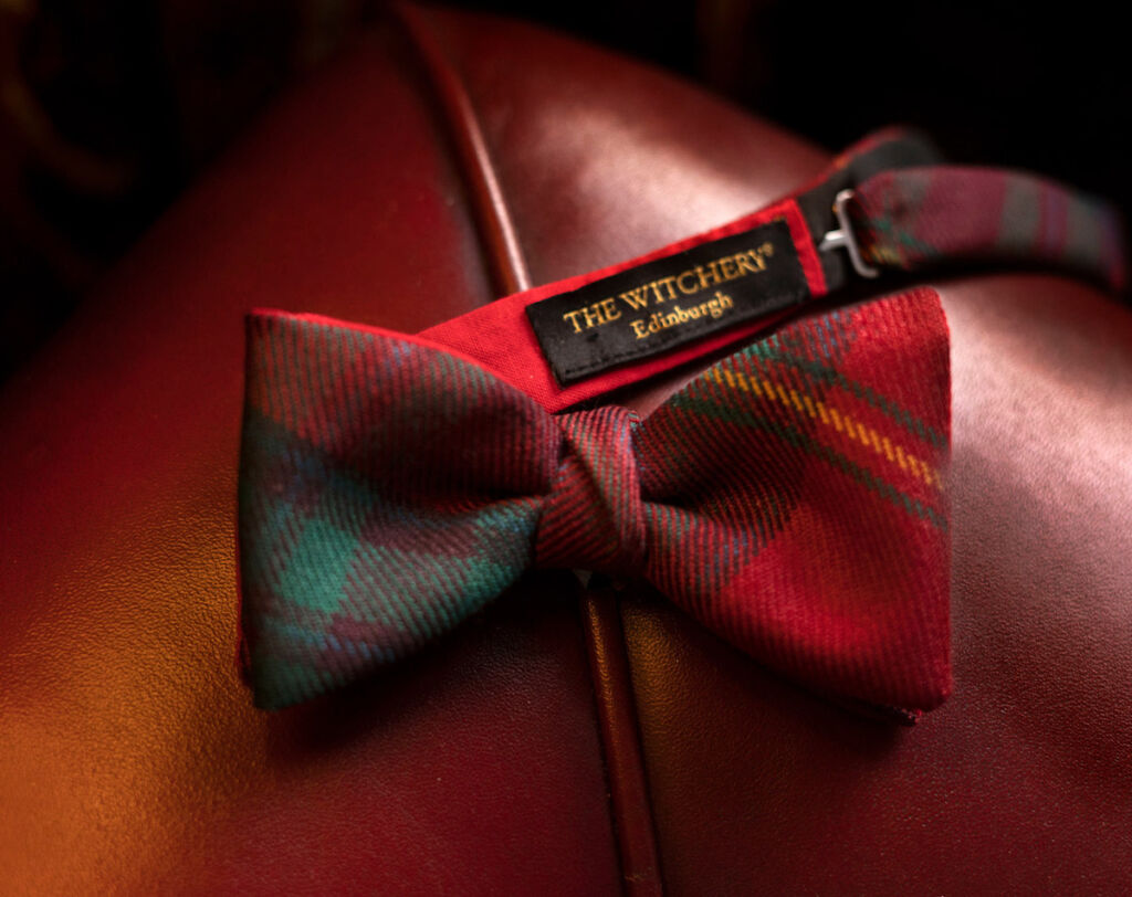 A branded tartan bow tie