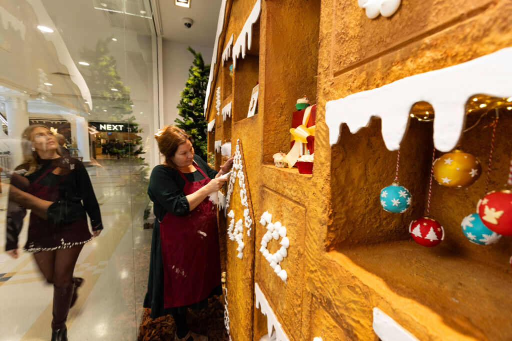 Icing being piped onto the window display