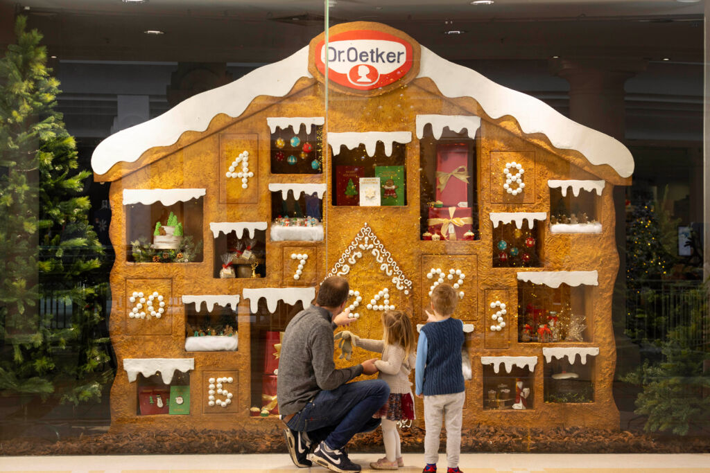 Children admiring the finished gingerbread house