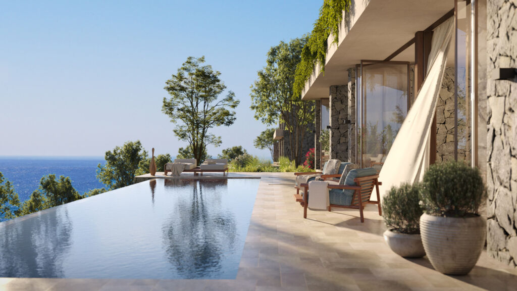 A terrace with infinity pool looking out over the water