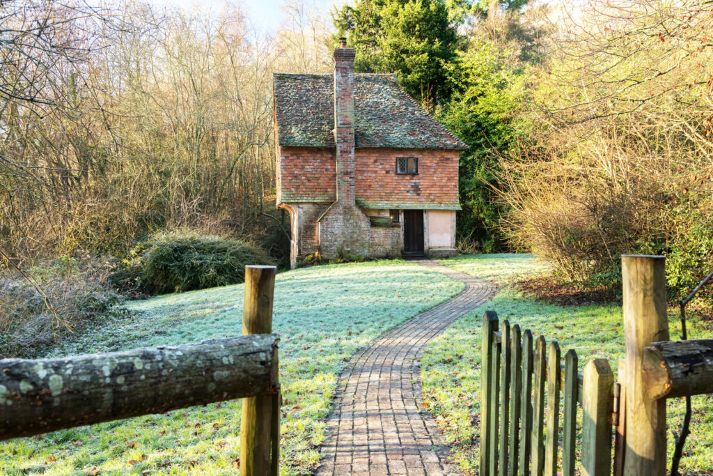 The exterior of Hole Cottage and its front garden