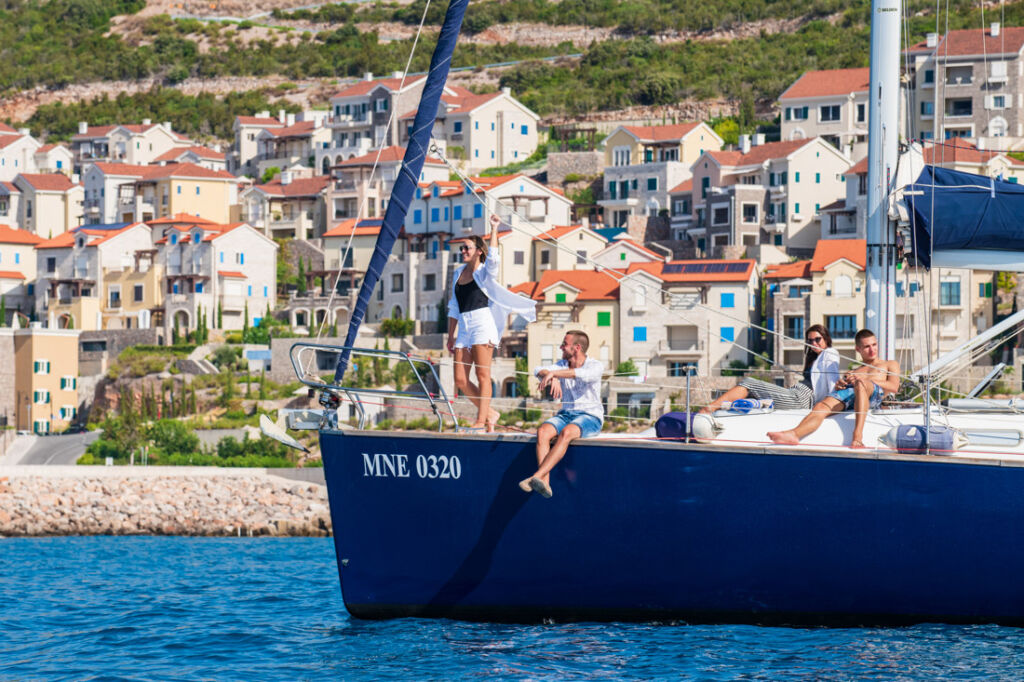 Guests cruising on the water on a sailing yacht