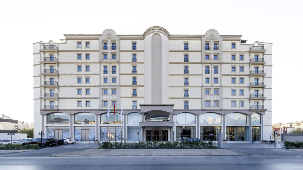 A photograph showing the exterior of the hotel in the daylight