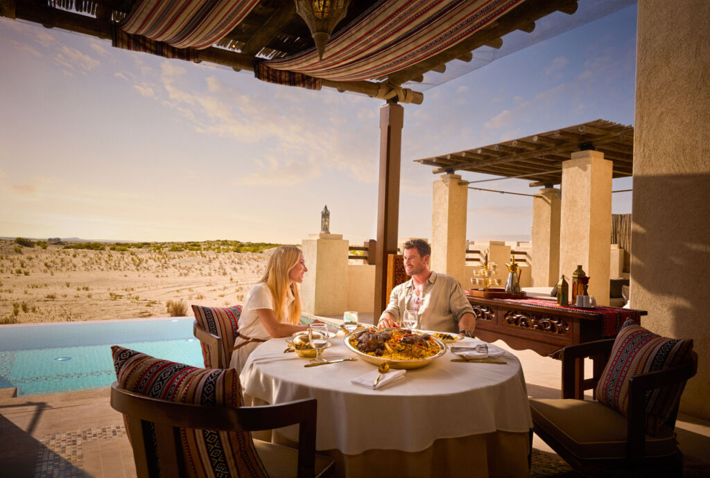 The couple enjoying a meal outdoors