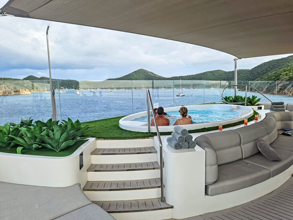 Passengers enjoying the view from a hot tub