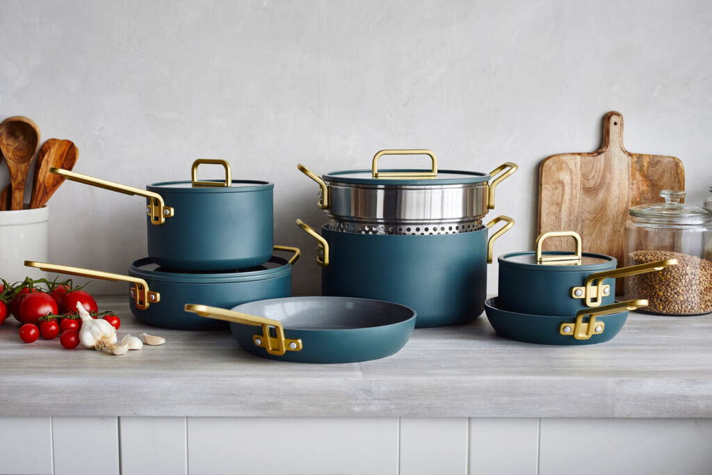 The collection in the Venetian Teal colour with gold handles